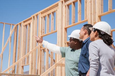 couple looking at their new construction home with loan from 1st national bank