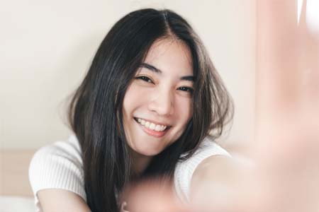 young woman happy to have a 1st national bank 1st checking web photo