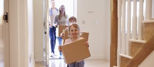 home-equity-loan kids carrying boxes into new house