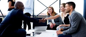 community banker shaking hands with local business owner business lines of cred