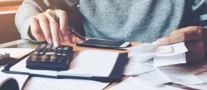 debt consolidation photo adding up bills