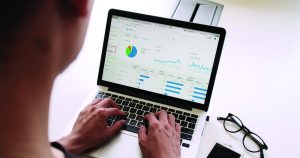 Do you have an overall financial strategy header photo financial data on laptop screen