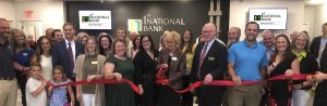 1st National Bank team at headquarters grand opening ribbon cutting