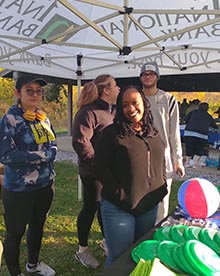 1st national bank employees running booth at dreams within reack 5k/10k