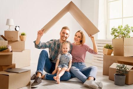 Young family happy in their new home with fha loan from 1st national bank