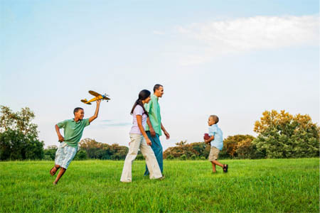 Family enjoying vacation from their money market high-yield savings account 1st national bank