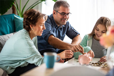 family teaching importance of savings with a certificate of deposit cd from 1st national bank